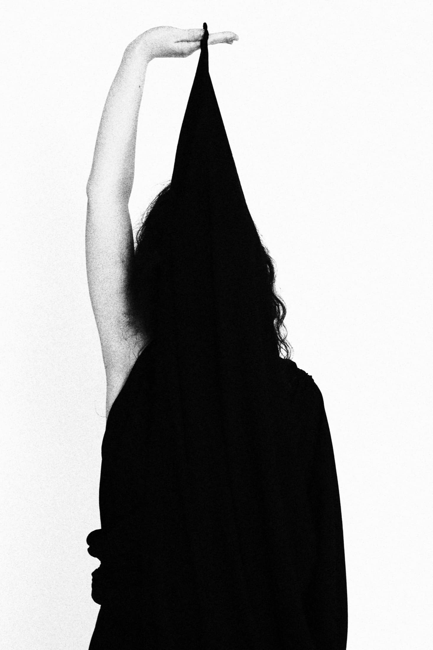 knitted wrap cardigan with an open back, black pants